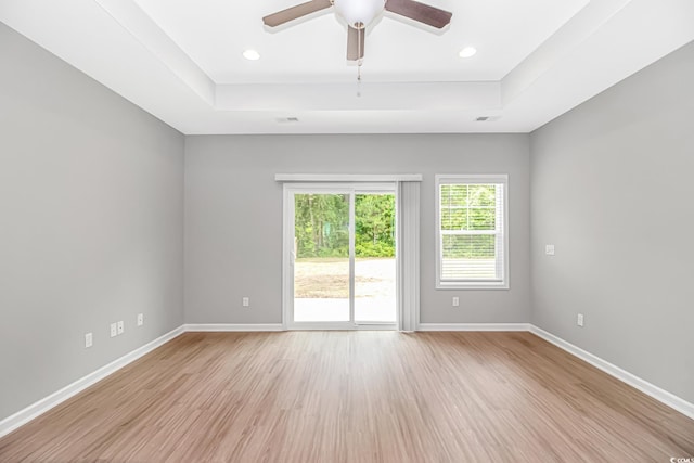 3539 Harrelson Ave, Loris, SC 29569 - unfurnished room featuring a raised ceiling, light wood-style flooring, baseboards, and recessed lighting