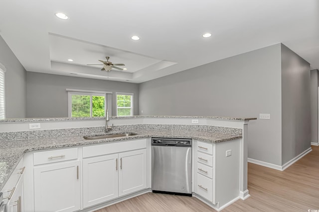3539 Harrelson Ave, Loris, SC 29569 - kitchen featuring stainless steel dishwasher, a sink, a ceiling fan, a raised ceiling, and light wood finished floors