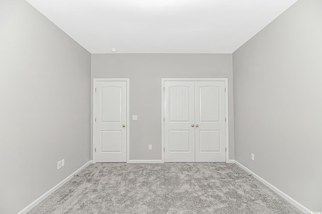 3539 Harrelson Ave, Loris, SC 29569 - unfurnished bedroom with a closet, carpet flooring, and baseboards