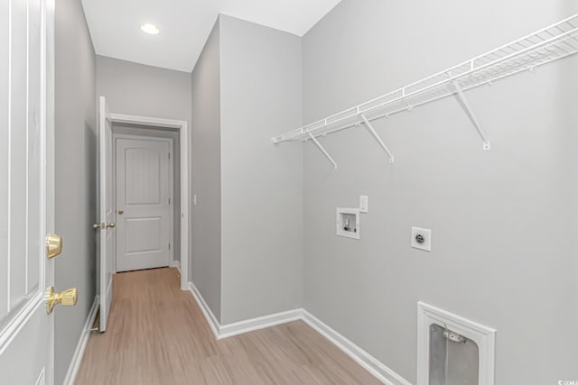 3539 Harrelson Ave, Loris, SC 29569 - laundry area featuring hookup for an electric dryer, hookup for a washing machine, light wood-type flooring, and baseboards