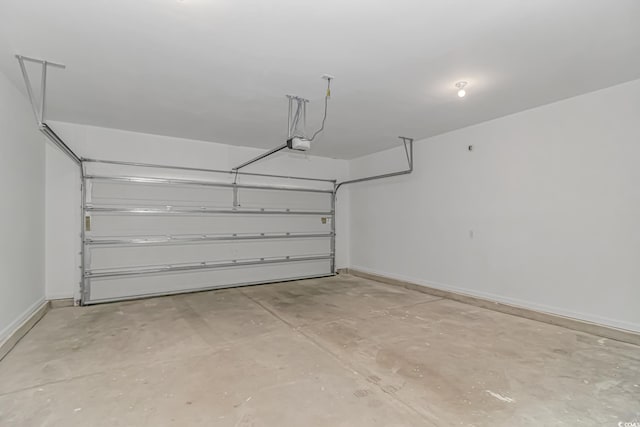 3539 Harrelson Ave, Loris, SC 29569 - garage featuring a garage door opener and baseboards