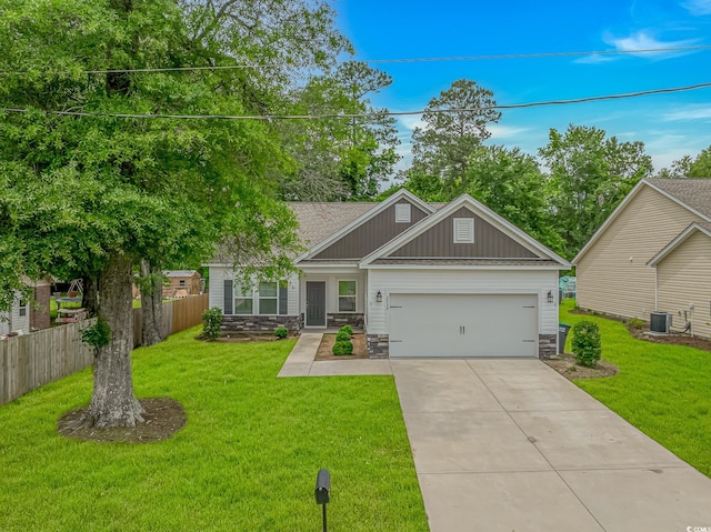 3539 Harrelson Ave, Loris, SC 29569 - craftsman-style house with stone siding, driveway, an attached garage, central AC unit, and board and batten siding