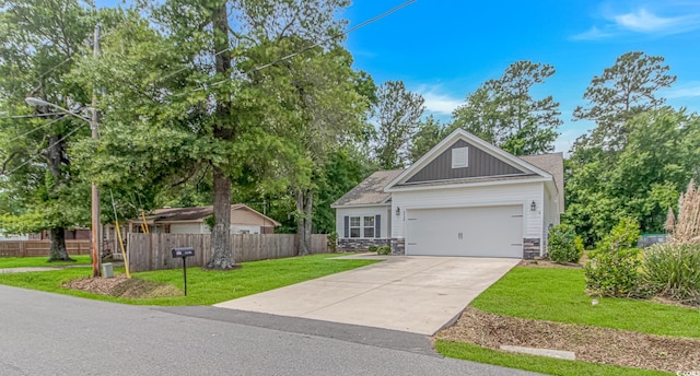 3539 Harrelson Ave, Loris, SC 29569 - view of front of house with stone siding, concrete driveway, board and batten siding, and a garage