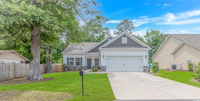 3539 Harrelson Ave, Loris, SC 29569 - craftsman-style house featuring an attached garage, driveway, stone siding, board and batten siding, and central AC