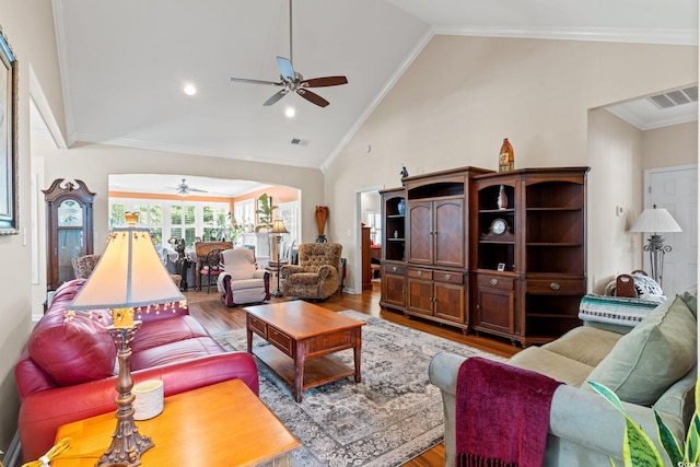 2567 Lake Vista Dr, Little River, SC 29566 - living room featuring a ceiling fan, wood finished floors, high vaulted ceiling, and crown molding