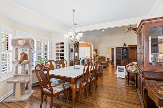 2567 Lake Vista Dr, Little River, SC 29566 - dining space featuring a chandelier, hardwood / wood-style floors, arched walkways, crown molding, and lofted ceiling