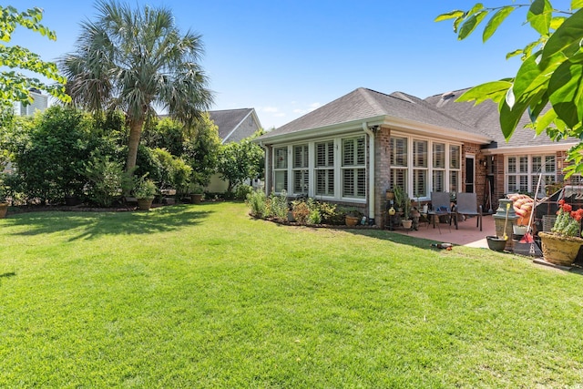 2567 Lake Vista Dr, Little River, SC 29566 - view of grassy yard with a patio