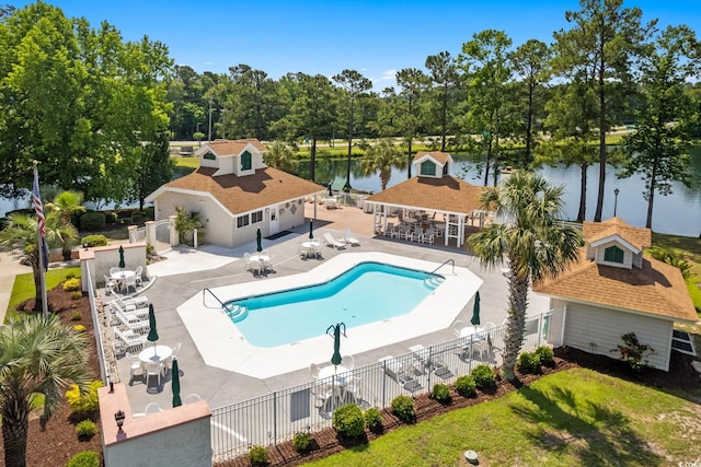 2567 Lake Vista Dr, Little River, SC 29566 - community pool with a water view, a patio, view of scattered trees, and outdoor dining area