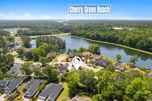 2567 Lake Vista Dr, Little River, SC 29566 - aerial view of residential area with a large body of water and a forest