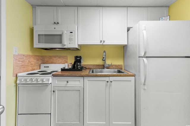 2207 S Ocean Blvd Unit 1517, Myrtle Beach, SC 29577 - kitchen featuring white appliances, a sink, and white cabinets