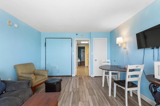 2207 S Ocean Blvd Unit 1517, Myrtle Beach, SC 29577 - living room featuring wood finish floors and baseboards