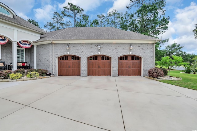 81 Cascade Dr, Murrells Inlet, SC 29576 - view of property exterior with concrete driveway, an attached garage, brick siding, and a shingled roof