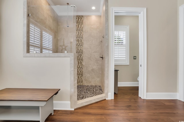 81 Cascade Dr, Murrells Inlet, SC 29576 - bathroom with crown molding, a walk in shower, toilet, wood finished floors, and baseboards