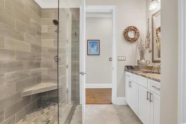 81 Cascade Dr, Murrells Inlet, SC 29576 - full bath with vanity, tiled shower, baseboards, and tile patterned floors