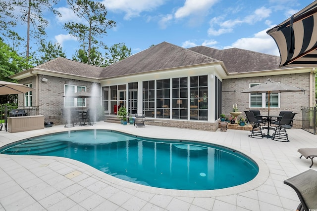 81 Cascade Dr, Murrells Inlet, SC 29576 - swimming pool featuring a patio area, a sunroom, outdoor dining area, and entry steps