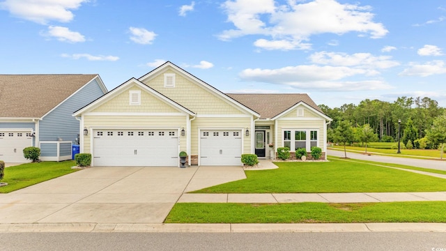 2300 Lark Sparrow St, Myrtle Beach, SC 29577 - view of front of house with an attached garage, a front lawn, and concrete driveway