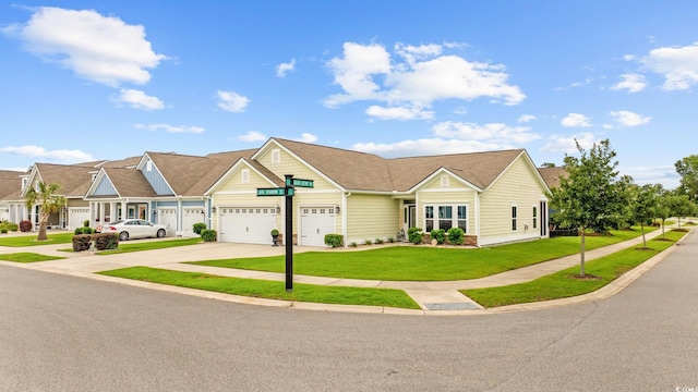 2300 Lark Sparrow St, Myrtle Beach, SC 29577 - view of front of house with driveway, a front yard, an attached garage, and a residential view