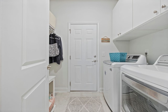 2300 Lark Sparrow St, Myrtle Beach, SC 29577 - laundry area with cabinet space, separate washer and dryer, and light tile patterned floors