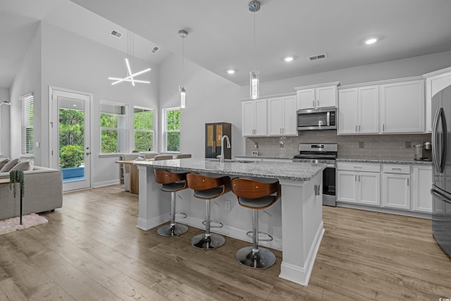 1168 Baker Creek Loop, Myrtle Beach, SC 29579 - kitchen with appliances with stainless steel finishes, a sink, decorative backsplash, white cabinets, and recessed lighting