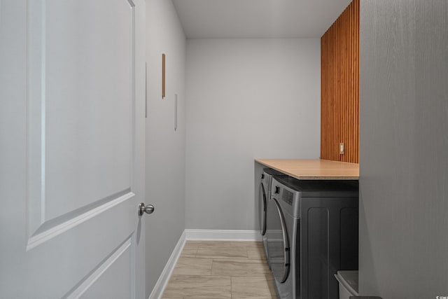 1168 Baker Creek Loop, Myrtle Beach, SC 29579 - laundry area with cabinet space, washing machine and dryer, light marble finish floors, and baseboards