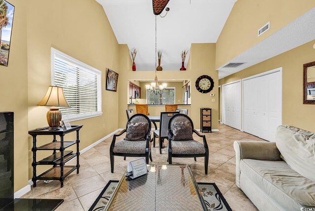 201 Westleton Dr Unit 10-I, Myrtle Beach, SC 29572 - living area with high vaulted ceiling, a chandelier, light tile patterned flooring, and baseboards