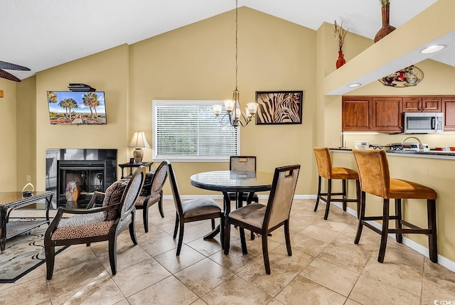 201 Westleton Dr Unit 10-I, Myrtle Beach, SC 29572 - dining area with high vaulted ceiling, a chandelier, a fireplace, and baseboards