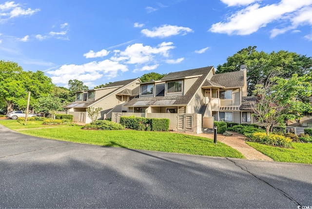 201 Westleton Dr Unit 10-I, Myrtle Beach, SC 29572 - view of front of property with a front yard and a chimney