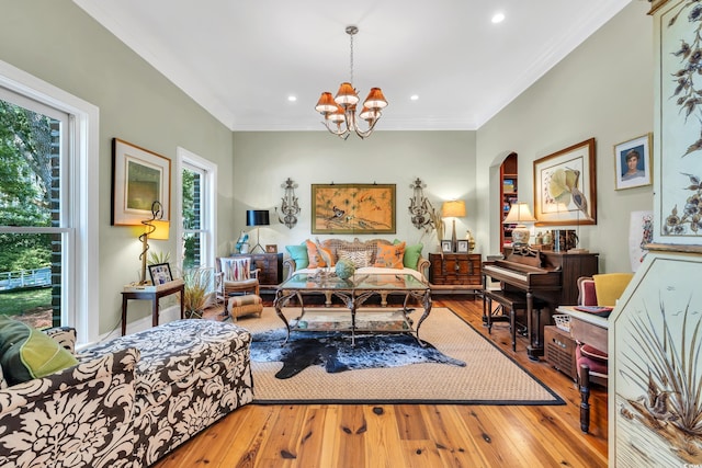 2382 Waverly Rd, Pawleys Island, SC 29585 - bedroom featuring hardwood / wood-style flooring, a chandelier, ornamental molding, arched walkways, and recessed lighting