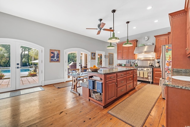 2382 Waverly Rd, Pawleys Island, SC 29585 - kitchen featuring french doors, stainless steel appliances, ceiling fan, recessed lighting, and exhaust hood