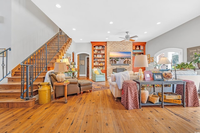 2382 Waverly Rd, Pawleys Island, SC 29585 - living room with arched walkways, ceiling fan, recessed lighting, stairs, and light wood finished floors