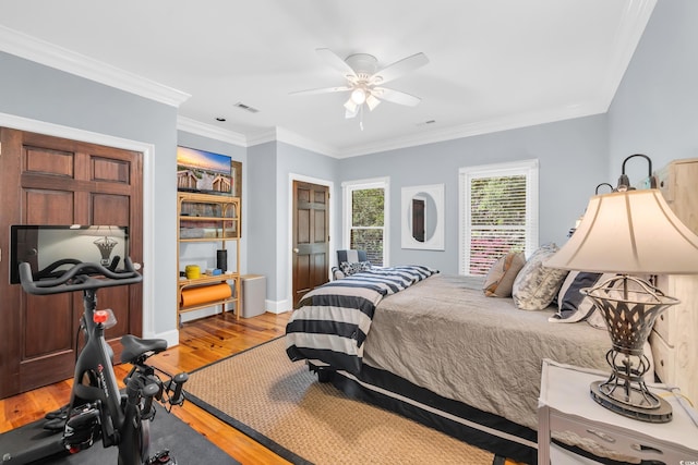 2382 Waverly Rd, Pawleys Island, SC 29585 - bedroom featuring light wood-style flooring, ornamental molding, a ceiling fan, and baseboards