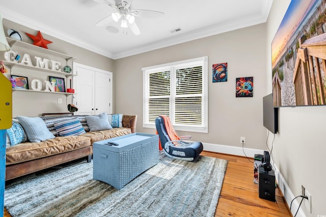 2382 Waverly Rd, Pawleys Island, SC 29585 - living area with ceiling fan, light wood-style floors, ornamental molding, and baseboards