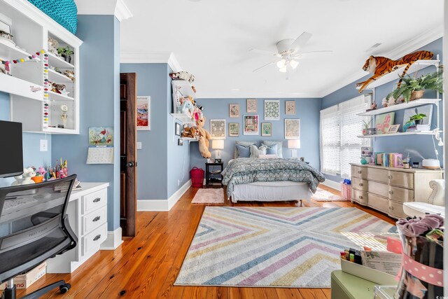 2382 Waverly Rd, Pawleys Island, SC 29585 - bedroom with crown molding, light wood-style flooring, baseboards, and a ceiling fan