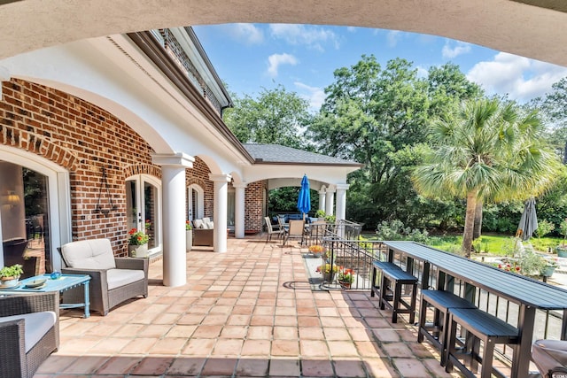 2382 Waverly Rd, Pawleys Island, SC 29585 - view of patio with outdoor dining area and view of scattered trees