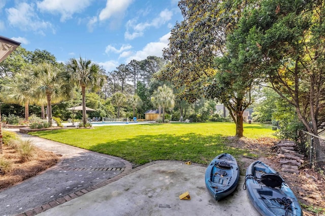 2382 Waverly Rd, Pawleys Island, SC 29585 - view of green lawn featuring a swimming pool and view of scattered trees