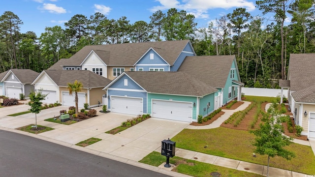 2475 Blue Crane Cir Unit 106, Myrtle Beach, SC 29577 - view of front of home with driveway, an attached garage, a shingled roof, and a front lawn