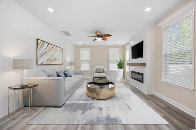 2475 Blue Crane Cir Unit 106, Myrtle Beach, SC 29577 - living area with ceiling fan, a fireplace, wood finished floors, baseboards, and recessed lighting