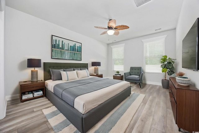2475 Blue Crane Cir Unit 106, Myrtle Beach, SC 29577 - bedroom with light wood-style flooring, baseboards, and ceiling fan