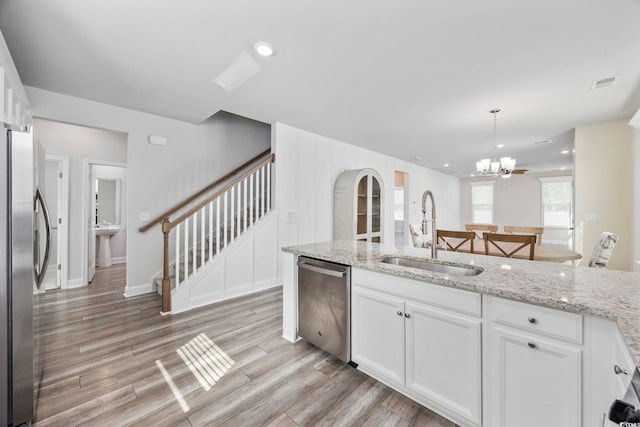 2475 Blue Crane Cir Unit 106, Myrtle Beach, SC 29577 - kitchen featuring stainless steel appliances, a sink, white cabinetry, a chandelier, and recessed lighting