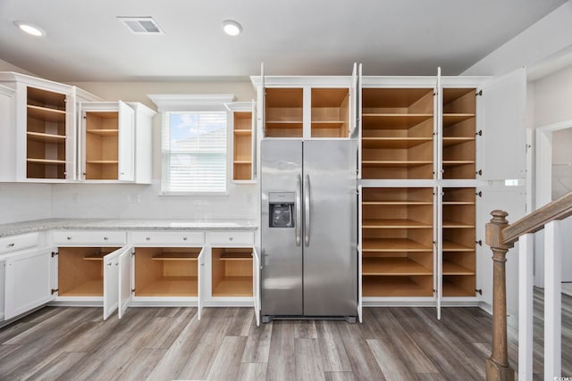 2475 Blue Crane Cir Unit 106, Myrtle Beach, SC 29577 - kitchen featuring stainless steel fridge, open shelves, light wood-type flooring, white cabinets, and recessed lighting