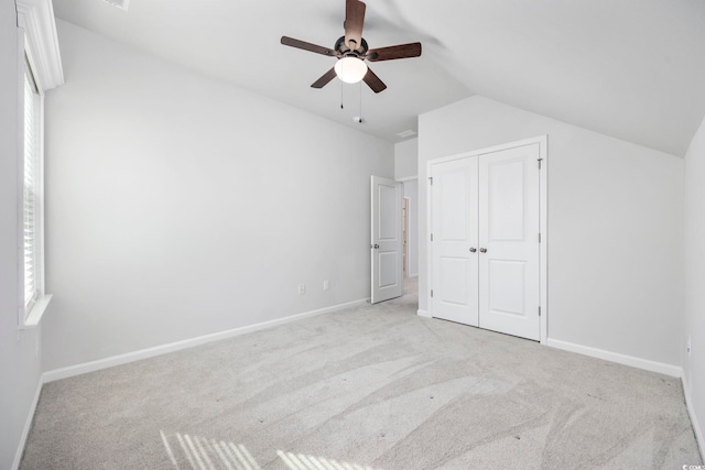 2475 Blue Crane Cir Unit 106, Myrtle Beach, SC 29577 - unfurnished bedroom with light colored carpet, vaulted ceiling, a closet, and baseboards