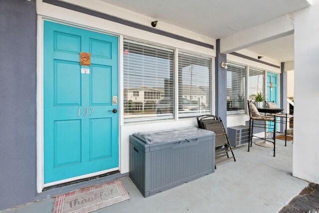5409 N Ocean Blvd Unit 106/7 108, North Myrtle Beach, SC 29582 - view of exterior entry featuring covered porch