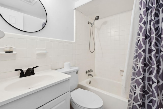 5409 N Ocean Blvd Unit 106/7 108, North Myrtle Beach, SC 29582 - bathroom featuring shower / bath combo, toilet, vanity, and tile walls