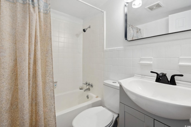 5409 N Ocean Blvd Unit 106/7 108, North Myrtle Beach, SC 29582 - full bath featuring toilet, shower / tub combo with curtain, vanity, and tile walls