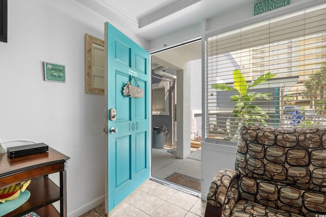 5409 N Ocean Blvd Unit 106/7 108, North Myrtle Beach, SC 29582 - entrance foyer featuring crown molding, light tile patterned floors, and baseboards