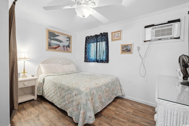 5409 N Ocean Blvd Unit 106/7 108, North Myrtle Beach, SC 29582 - bedroom featuring wood finished floors, crown molding, baseboards, ceiling fan, and a wall unit AC