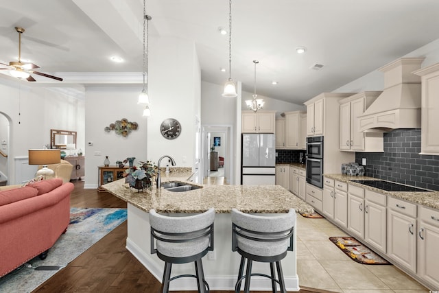 2318 Via Palma Dr, North Myrtle Beach, SC 29582 - kitchen featuring a sink, freestanding refrigerator, stainless steel double oven, lofted ceiling, and ceiling fan