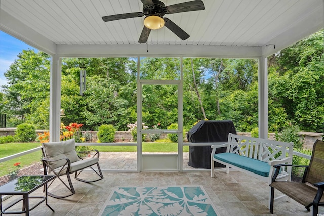 2318 Via Palma Dr, North Myrtle Beach, SC 29582 - sunroom / solarium featuring a ceiling fan and view of scattered trees
