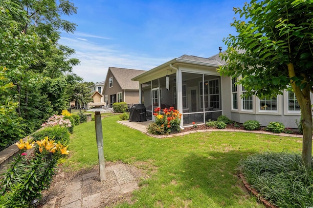 2318 Via Palma Dr, North Myrtle Beach, SC 29582 - view of green lawn featuring a sunroom