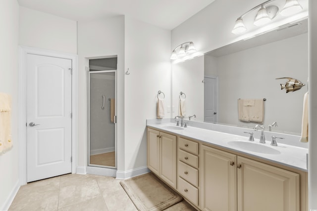 2318 Via Palma Dr, North Myrtle Beach, SC 29582 - bathroom featuring double vanity, a stall shower, tile patterned flooring, and baseboards
